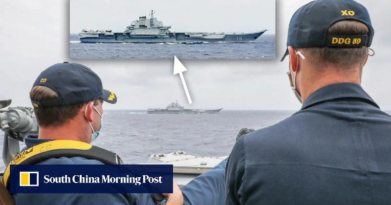 周日，美国海军公布一张周一拍摄的图片，照片中，“马斯廷”号驱逐舰的船长布里格斯和其副官斯莱正在观察仅数公里外的中国“辽宁”号航母